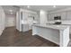 Modern kitchen featuring gray cabinets, granite countertops, stainless steel appliances, and a kitchen island at 1133 Hallman Branch Ln, Lincolnton, NC 28092