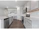 Bright kitchen with gray cabinets, granite countertops, stainless steel appliances, and a tiled backsplash at 1133 Hallman Branch Ln, Lincolnton, NC 28092