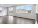 Bright living room features wood floors, large windows, and a glass door to the outside at 1133 Hallman Branch Ln, Lincolnton, NC 28092