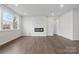 Bright and airy living room featuring hardwood floors, a modern fireplace, and ample natural light at 1133 Hallman Branch Ln, Lincolnton, NC 28092
