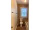 Bathroom features stone tile accents, and standard toilet and tub at 1313 Eastway Dr, Charlotte, NC 28205