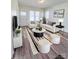 Bright living room featuring hardwood floors, neutral paint, and lots of natural light at 1313 Eastway Dr, Charlotte, NC 28205