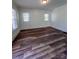 Living room features hardwood floors, neutral paint, and lots of natural light at 1313 Eastway Dr, Charlotte, NC 28205