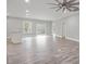 Bright, open living area with sleek floors, recessed lighting, and a ceiling fan, seamlessly flowing to outdoor access at 3007 Buffett Ln, Monroe, NC 28110