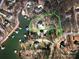 Expansive waterfront lot on Lake Norman with lush greenery and mature trees outlined in green at 3853 Gordon St, Terrell, NC 28682