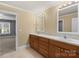Bathroom featuring double vanity with wood cabinets and neutral-toned walls at 3853 Gordon St, Terrell, NC 28682
