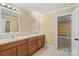 Bathroom featuring double vanity with wood cabinets and neutral-toned walls at 3853 Gordon St, Terrell, NC 28682