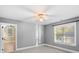 A sunlit bedroom featuring neutral walls, plush carpet, and a ceiling fan at 3853 Gordon St, Terrell, NC 28682