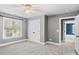 Bright bedroom with plush carpeting, large windows, and double door closet at 3853 Gordon St, Terrell, NC 28682