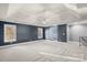 Spacious bedroom featuring tray ceilings, carpeted floors, and natural light from the windows at 3853 Gordon St, Terrell, NC 28682