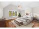 Bright bedroom featuring a large window, vaulted ceiling, ceiling fan, and neutral decor at 3853 Gordon St, Terrell, NC 28682