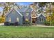 Charming exterior view of two-story home with stone and blue siding at 3853 Gordon St, Terrell, NC 28682