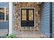 Double front doors with stone surround and glass inserts at 3853 Gordon St, Terrell, NC 28682