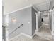 Upstairs hallway featuring gray walls, white trim, and carpeted floors at 3853 Gordon St, Terrell, NC 28682