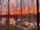 Lake view featuring colorful sunrise and boat dock at 3853 Gordon St, Terrell, NC 28682