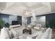 Comfortable upstairs living room with coffered ceiling, stylish decor, and ample seating at 3853 Gordon St, Terrell, NC 28682
