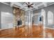 Bright living room with hardwood floors, a stone fireplace, and custom built-in shelving at 3853 Gordon St, Terrell, NC 28682