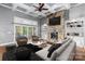 Cozy living room with stone fireplace, coffered ceilings, and access to the outdoor space at 3853 Gordon St, Terrell, NC 28682