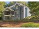Side view of rear exterior showing screened in porch and terraced planting beds at 3853 Gordon St, Terrell, NC 28682
