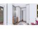 Bar area with a wine refrigerator, wooden cabinets, and modern wall sconce at 428 Dover Ave, Charlotte, NC 28209