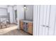 Bar with wood cabinets, a beverage refrigerator, and modern gold lighting fixture at 428 Dover Ave, Charlotte, NC 28209