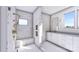 Bathroom featuring a large walk-in shower, vanity with a sink, and window with views to the outdoors at 428 Dover Ave, Charlotte, NC 28209