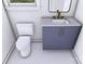 A compact bathroom featuring a navy blue vanity, matching mirror, and a white toilet at 428 Dover Ave, Charlotte, NC 28209