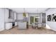 Modern kitchen features white cabinets, stainless steel appliances, and an island with bar seating at 428 Dover Ave, Charlotte, NC 28209