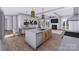 Open concept kitchen with designer fixtures, large island with seating and stainless appliances at 428 Dover Ave, Charlotte, NC 28209