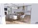 Dining area featuring a modern chandelier, views to the gourmet kitchen and living space at 428 Dover Ave, Charlotte, NC 28209