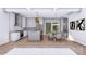 Open-concept living space featuring a kitchen island, dining area, and modern design elements at 428 Dover Ave, Charlotte, NC 28209