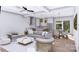 Well-lit living room with a view to the kitchen and dining area, creating an ideal space for relaxation at 428 Dover Ave, Charlotte, NC 28209