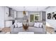 Bright living room with an open layout including the kitchen and dining space at 428 Dover Ave, Charlotte, NC 28209