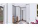 Compact wet bar featuring a wine fridge, storage cabinets, and a marble countertop at 428 Dover Ave, Charlotte, NC 28209