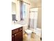Bright bathroom with a shower-tub combination, vanity, and modern fixtures at 13112 Appolinaire Dr, Davidson, NC 28036