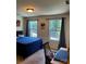 Bright bedroom with two windows, a desk, and neutral walls; perfect for relaxing at 13112 Appolinaire Dr, Davidson, NC 28036