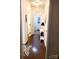 Hallway with hardwood floors leading to the laundry room, showcasing a clean and well-maintained interior at 13112 Appolinaire Dr, Davidson, NC 28036