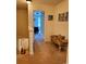 Bright hallway with cozy seating area leads to bedroom; features neutral carpeting at 13112 Appolinaire Dr, Davidson, NC 28036
