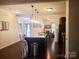 Open-concept kitchen with a center island and stainless steel appliances, creating an ideal space for cooking at 13112 Appolinaire Dr, Davidson, NC 28036