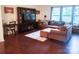Warm and inviting living room featuring a plush sectional couch and a large entertainment center at 13112 Appolinaire Dr, Davidson, NC 28036