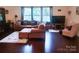 Bright and spacious living room with neutral decor, hardwood floors, and plenty of natural light at 13112 Appolinaire Dr, Davidson, NC 28036