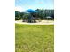 Community playground featuring slides, climbing structures, and a covered picnic area, perfect for outdoor Gathering fun at 13112 Appolinaire Dr, Davidson, NC 28036