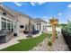 Private backyard patio with grill, seating area, and artificial turf at 15126 Sustar Farm Dr # 36, Matthews, NC 28105