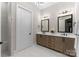 Elegant bathroom with double vanity and a large mirror at 15126 Sustar Farm Dr # 36, Matthews, NC 28105