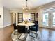 Bright dining area with barn door entry and a view of the backyard at 15126 Sustar Farm Dr # 36, Matthews, NC 28105