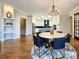Elegant dining room with a round table and modern chandelier at 15126 Sustar Farm Dr # 36, Matthews, NC 28105