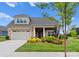 Attractive Craftsman style home with stone accents and landscaped front yard at 15126 Sustar Farm Dr # 36, Matthews, NC 28105
