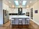 Modern kitchen with white cabinetry, a large island, and high-end appliances at 15126 Sustar Farm Dr # 36, Matthews, NC 28105
