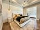 Spacious main bedroom with sitting area and wood floors at 15126 Sustar Farm Dr # 36, Matthews, NC 28105