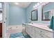 Bathroom with double vanity and a large soaking tub at 20109 Norman Colony Rd, Cornelius, NC 28031